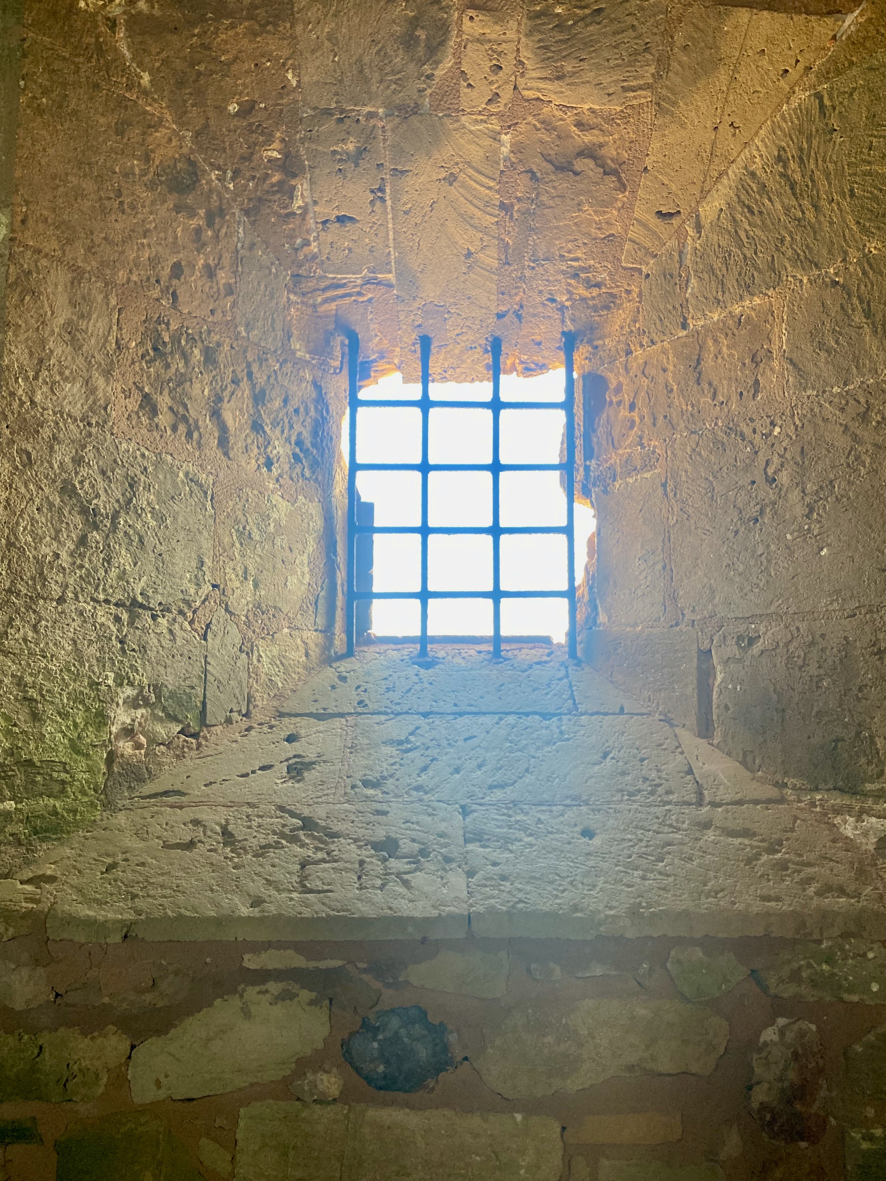 Stone window with iron bars for The Incarcerated Mediterranean project